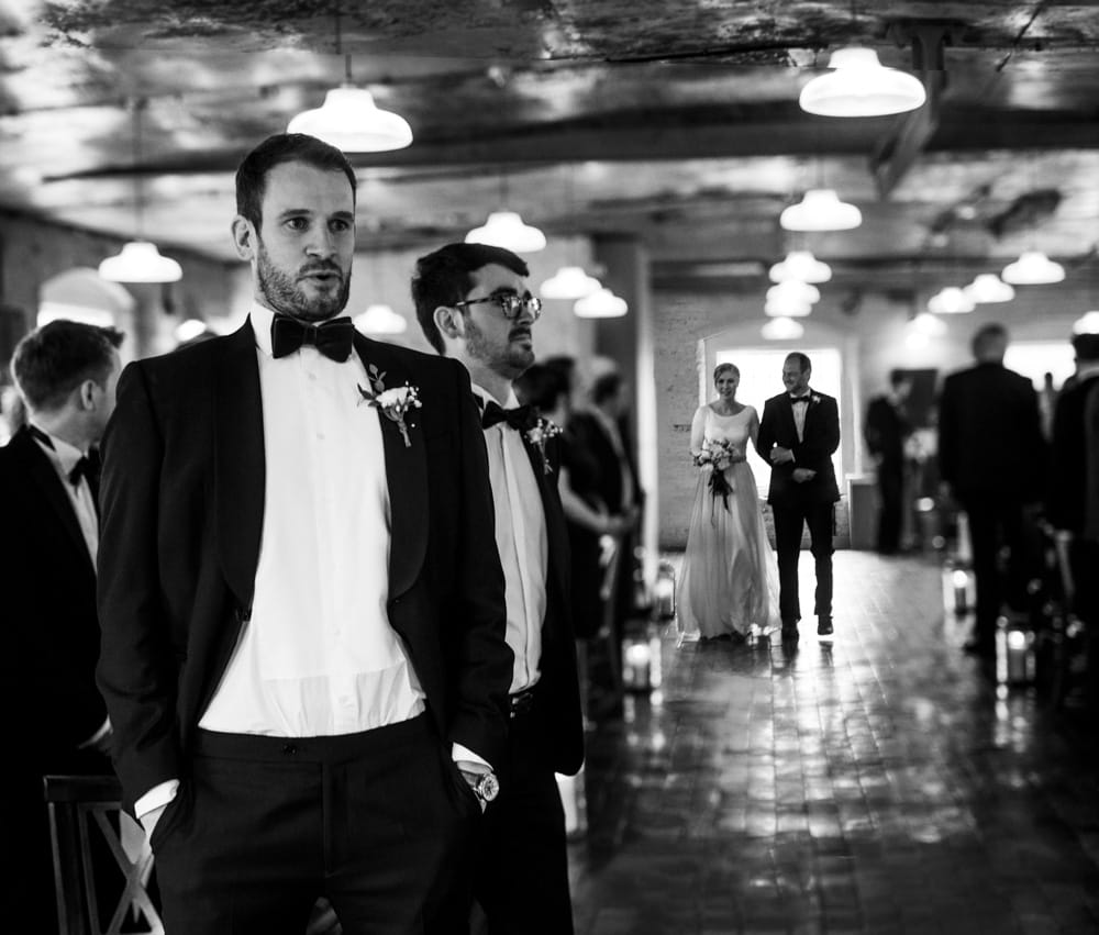 groom waiting at the top of the isle
