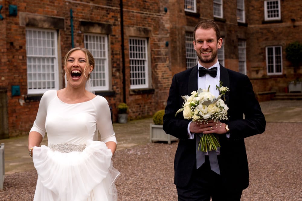 bride laughing at the groom
