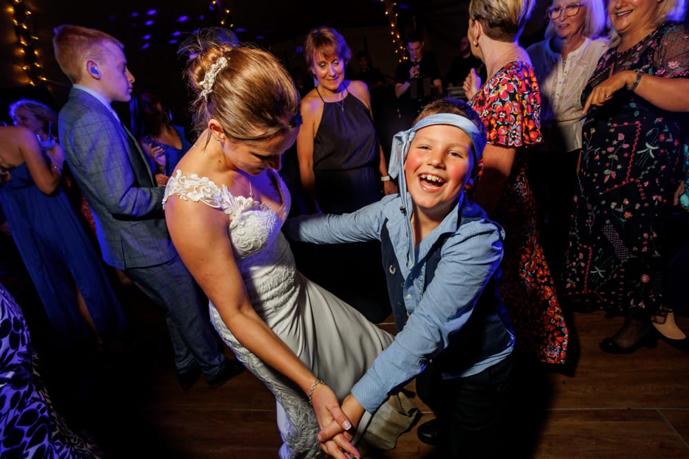 bride dancing with guest
