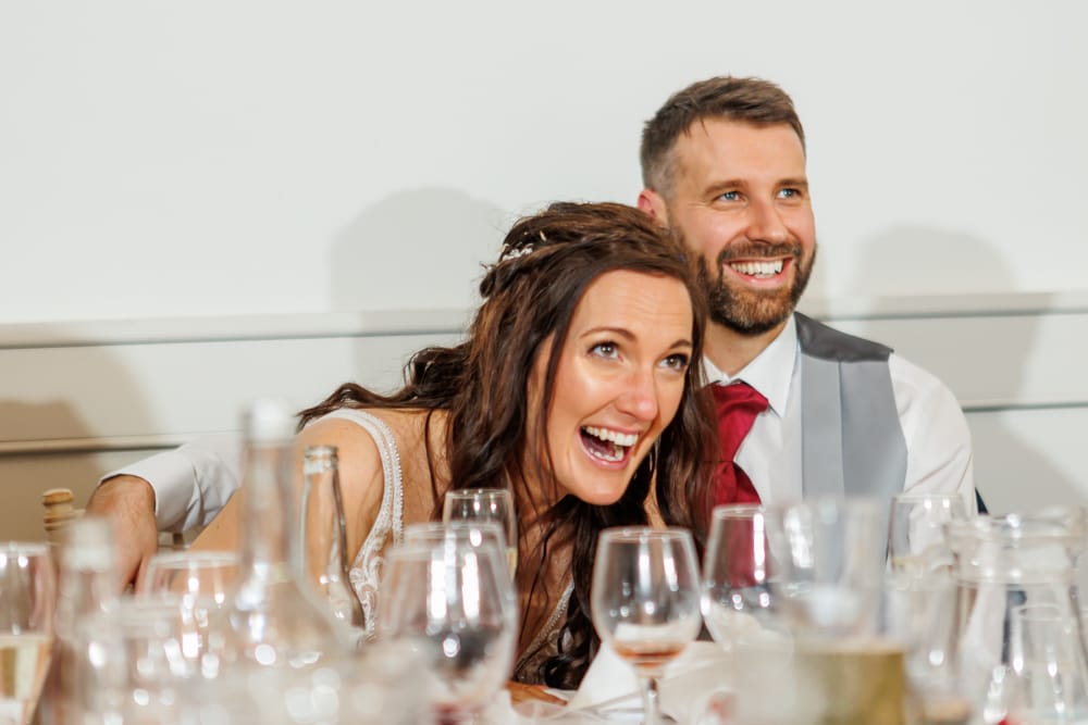 bride and groom laughing