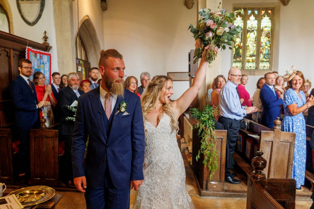 bride and groom walking out of the ceremony