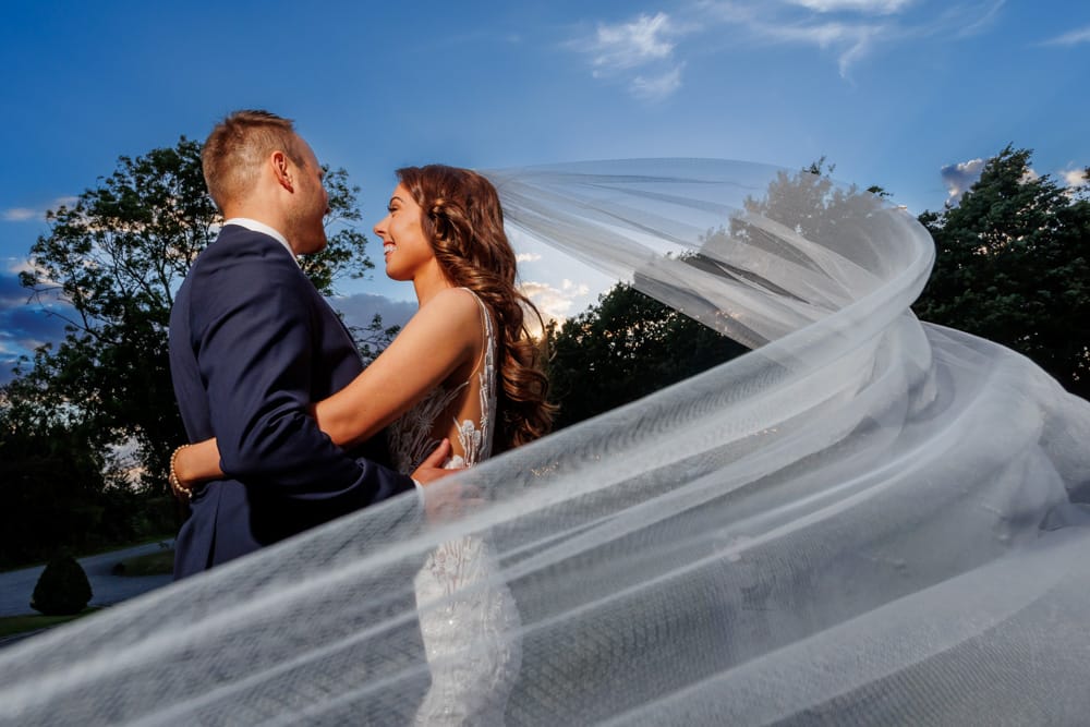 bride and groom hugging