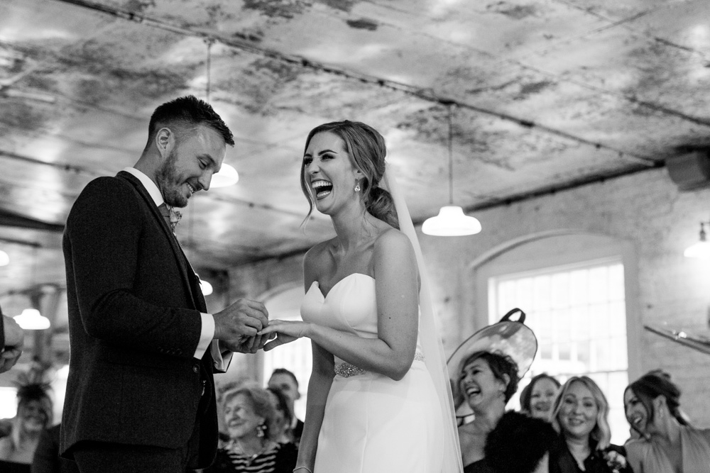 bride and groom laughing during the ceremony