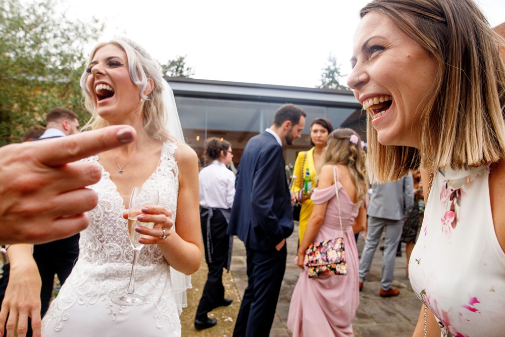 guests laughing during drinks reception