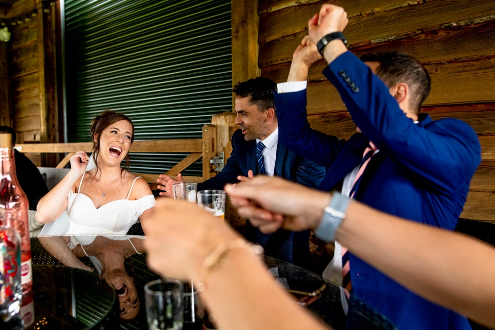 guests laughing during drinks reception 