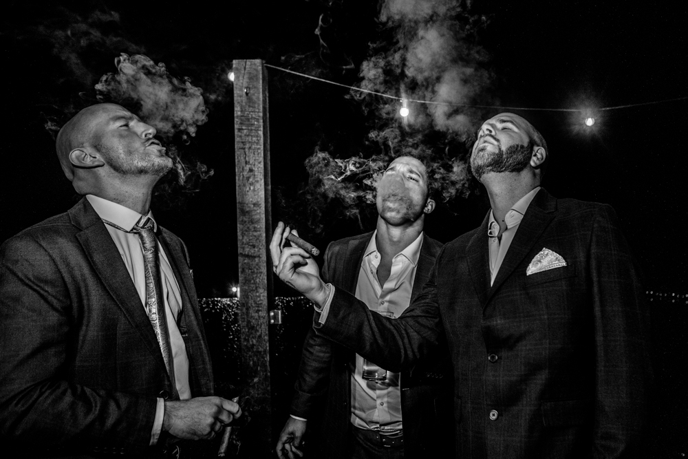 groomsmen smoking a cigar