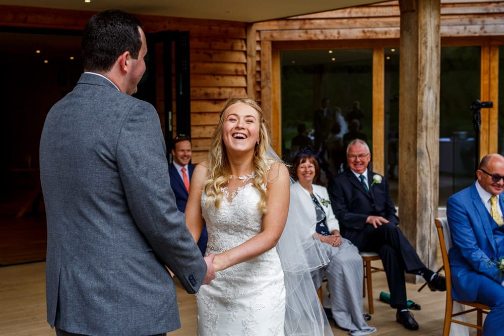 bride and groom laughing 