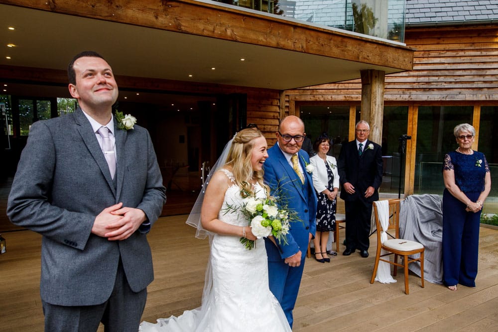 bride and groom walking down the isle
