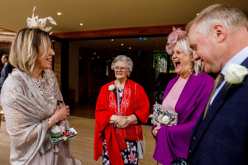 wedding guests laughing